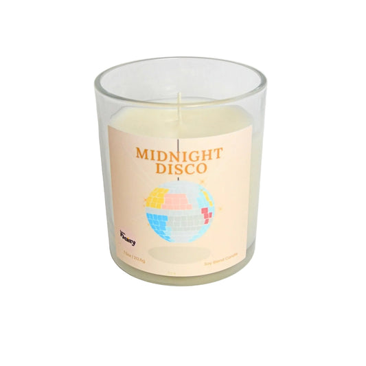 Candle in a glass jar labeled 'Midnight Disco' on a light gray background